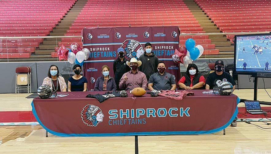 Shiprock football player signs on for college