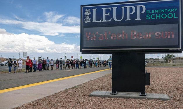 Dozens of fans greet man walking in bear suit