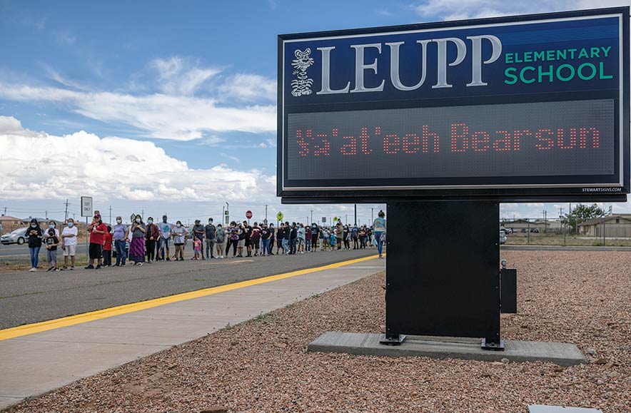 Dozens of fans greet man walking in bear suit