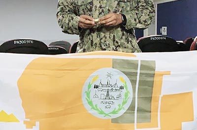 People | Chinle sailor posts Diné flag at camp