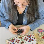 Guided by the past:  Lakota beadworker campaigns against derogatory name for stitch