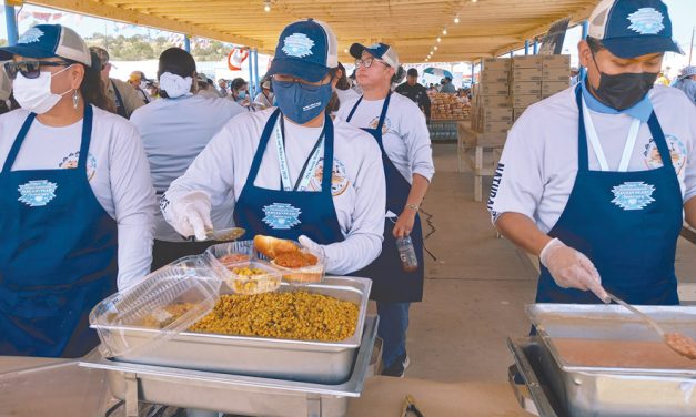 Division of Natural Resources staff serve pulled pork barbecue to hungry fairgoers