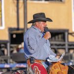 Longtime rodeo announcer Boyd Polhamus works up the crowd