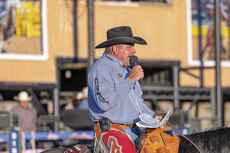 Longtime rodeo announcer Boyd Polhamus works up the crowd