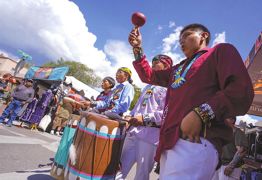 Young people from Jemez Pueblo maintain tradition through dance and song at the Santa Fe Indian Market