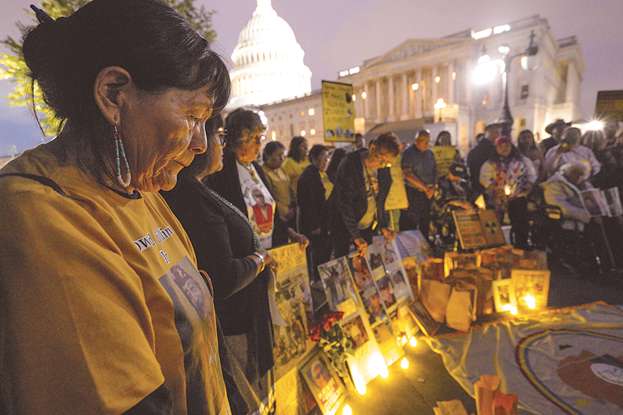 Candlelight vigil honors victims of uranium mining and atomic testing