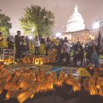 Candlelight vigil honors victims of uranium mining and atomic testing