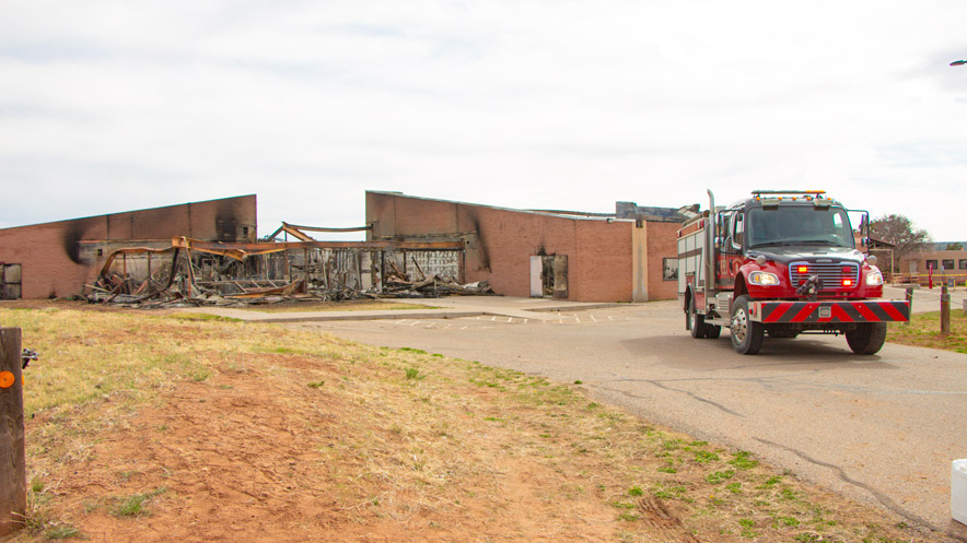 Navajo Times | Robert Bettis A Navajo Nation Fire and Rescue truck is parked at Diné College in Tsaile, Ariz., where the Student Union building was destroyed in a fire on April 14, 2025.