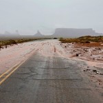 Flooding damages roads as power, water outages persist
