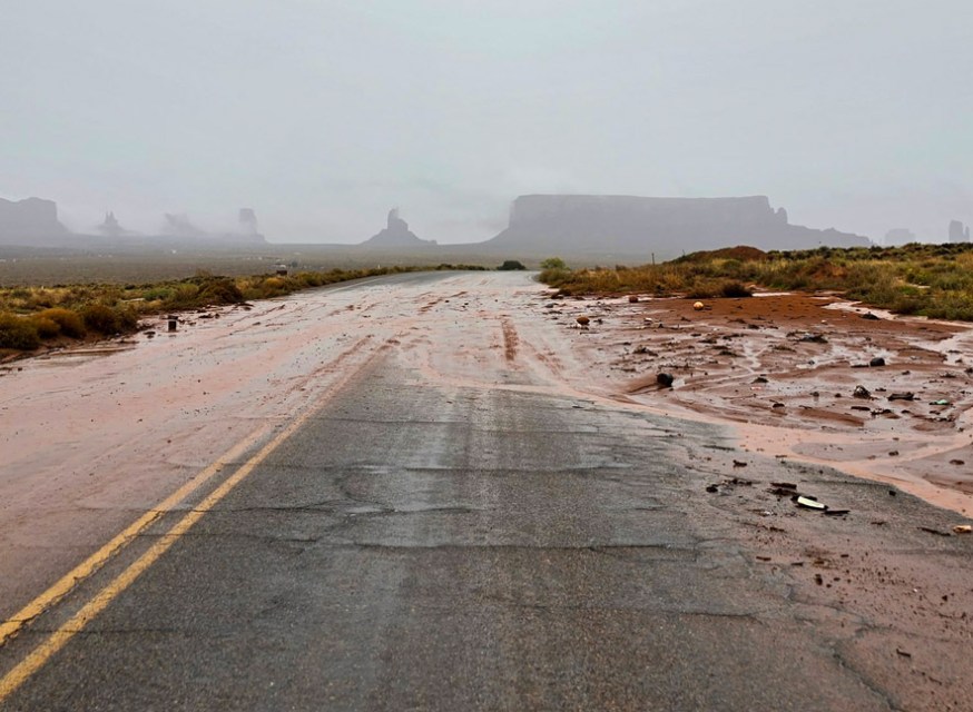 Flooding damages roads as power, water outages persist